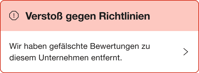 A Red warning alert banner that says "Breach of guidelines. We've removed a number of fake reviews for this company."