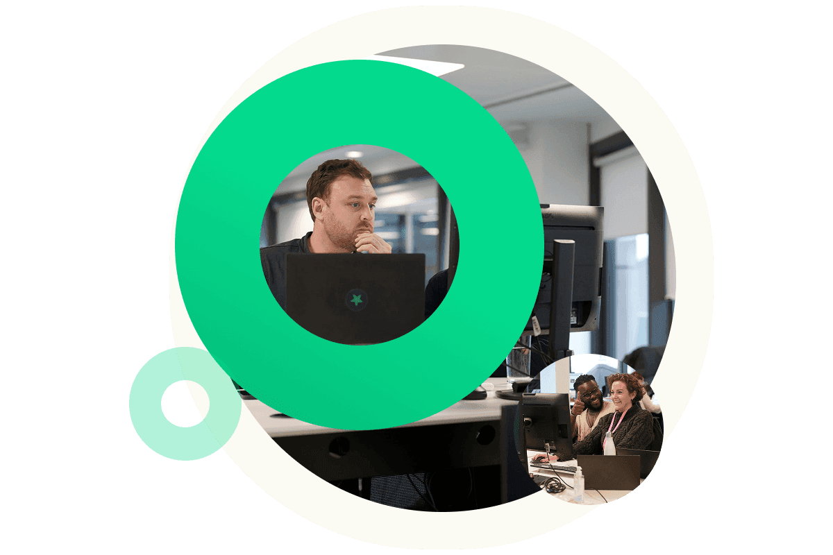 A Green circle graphic which contains an image in the centre of a man using his laptop, at his desk